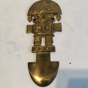 Vintage brass wall hanging featuring the fertility god Made in Peru,